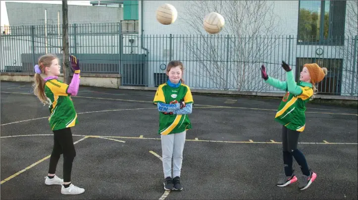  ??  ?? Kayla Page, Zara Grouse Mia Lavelle taking part in the ‘Peil for All’ event at Gorey Central School.