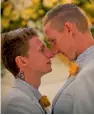  ?? — AFP ?? Australian Commonweal­th Games sprinter Craig Burns ( right) and fiance Luke Sullivan during their wedding ceremony in New South Wales, Australia, on Monday, minutes after midnight when the same sex- marriage law came into force on January 9.