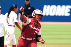  ?? ALONZO ADAMS/ASSOCIATED PRESS ?? Oklahoma’s Joceln Alo rejoices after hitting a first-inning home run against Texas in the Sooners’ 7-2 win in the Softball World Series on Saturday.