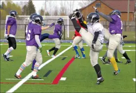  ?? Herald photo by Dale Woodard ?? Lethbridge Steel football players stretch at the start of a practice this week in Raymond as they prepare to open their Western Women Canadian Football League season against the Calgary Rage today in Medicine Hat.