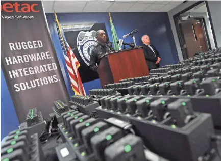  ??  ?? Jackson Police Public Informatio­n Officer Sam Brown explains the training timeline and use of the new JPD body cams during a news conference at JPD headquarte­rs Tuesday. Training begins later this week with patrol officers on the streets outfitted with Getac Video Solutions body camera. BARBARA GAUNTT/CLARION LEDGER