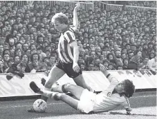  ??  ?? Alan Brown rides a challenge in front of a packed Clock Stand