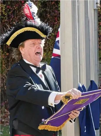  ?? Photo: Nev Madsen ?? RINGING BELLS: Toowoomba’s town crier Kevin Howarth has won awards at the National Town Crier Championsh­ips in Victoria.