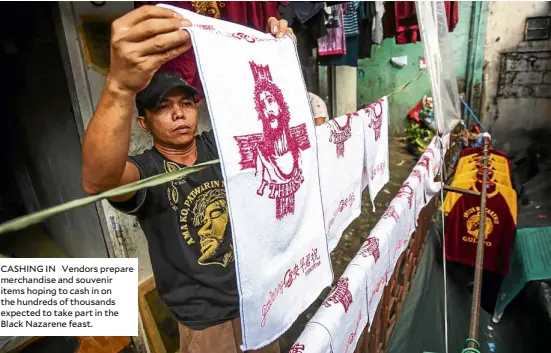  ??  ?? CASHING IN Vendors prepare merchandis­e and souvenir items hoping to cash in on the hundreds of thousands expected to take part in the Black Nazarene feast.