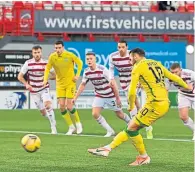  ??  ?? Hibs’ Martin Boyle scores from the spot