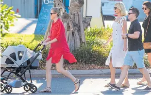  ??  ?? Dec’s wife Ali with baby Isla leads the way as the TV team heads out for dinner