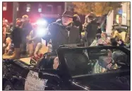  ??  ?? ABOVE: Rome High’s Air Force Junior ROTC color guard marches up Broad Street in Tuesday’s parade.LEFT: William S. Davies is honored for his community service by being named Grand Marshal of the 2018 Rome Christmas Parade.BELOW: Brothers Lindon Howe, 4, and Lee McLemore, 5, of Rome wait for the parade.