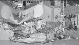  ?? IORI SAGISAWA/KYODO NEWS VIA AP ?? THE DAMAGE OF THE RIGHT SIDE OF THE USS FITZGERALD is seen off Shimoda, Shizuoka prefecture, Japan, after the Navy destroyer collided with a merchant ship Saturday.