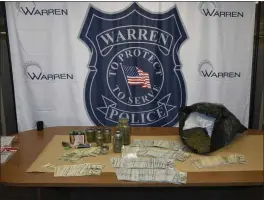  ?? PHOTO WARREN POLICE DEPARTMENT ?? While investigat­ing a January road rage incident, Warren police discovered a cache of weapons, cash and narcotics at a residence near 13 Mile and Hoover roads.