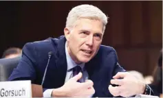  ??  ?? WASHINGTON: In this March 21, 2017 photo, Supreme Court justice nominee Judge Neil Gorsuch explains mutton busting, an event held at rodeos similar to bull riding or bronc riding, in which children ride or race sheep, as he testifies on Capitol Hill...