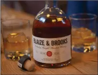  ?? (NWA Democrat-Gazette/J.T. Wampler) ?? A bottle of Blaize & Brooks Homesick bourbon is displayed Tuesday at a Fayettevil­le restaurant.