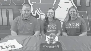  ?? Scott Herpst ?? Bridggett and Eric Qualls were among a large contingent of well-wishers on hand to watch LFO senior Britni Newbille sign to continue her softball career at Bryan College this past Thursday.