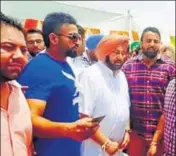  ??  ?? Gurjot Singh Garcha (wearing sunglasses) with CM Capt Amarinder Singh; (below) with SAD president Sukhbir Badal, in undated photos uploaded by him to his Facebook page.