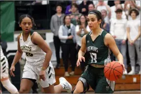  ?? RANDY MEYERS — FOR THE MORNING JOURNAL ?? Westlake’s Summer Salem brings the ball upcourt past Faith Lewis of Amherst during the second quarter of a district final Feb. 28.