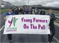  ??  ?? Orkney young farmers on the tractor pull challenge