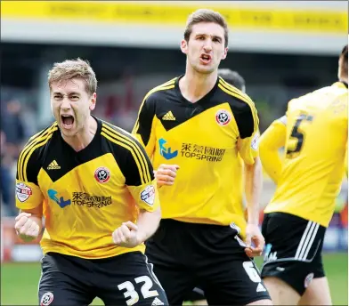  ??  ?? PUMPED UP: Steven Davies celebrates opening the scoring with the impressive Chris Basham