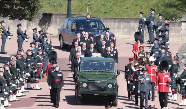  ?? Reuters ?? ↑
Members of the Royal Family follow the hearse, a specially modified Land Rover, during the funeral of Prince Philip on the grounds of Windsor Castle on Sunday.