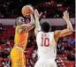  ?? NATE BILLINGS, THE OKLAHOMAN] ?? Oklahoma State guard Jawun Evans, left, announced Tuesday he will forego his final two years of eligibilit­y and enter the 2017 NBA Draft. [PHOTO BY