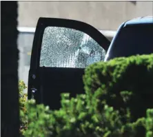  ?? NICK PROCAYLO/Postmedia News ?? A car in Langley was riddled with bullet holes.