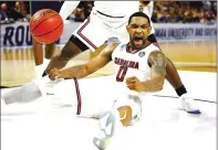  ?? GREGORY SHAMUS / GETTY IMAGES ?? Sindarius Thornwell, celebratin­g in South Carolina’s victory over Marquette, has been nearly unstoppabl­e during the tournament with 26 points per game.