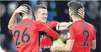  ??  ?? Jonathan Hogg celebrates with Christophe­r Schindler and sub Tommy Smith