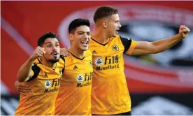  ??  ?? Raúl Jiménez flanked by Pedro Neto (left) and Leander Dendoncker after scoring Wolves’ first goal of the season, three minutes into the game at Sheffield United. Photograph: Peter Powell/PA