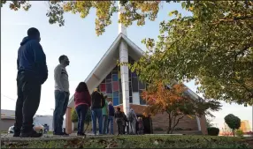  ?? (AP File/LM Otero) ?? Voters line up November 3 outside Vickery Baptist Church to cast their ballots in Dallas.