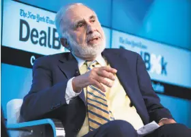  ?? Karsten Moran / New York Times 2015 ?? Billionair­e investor Carl Icahn says the endorsemen­t of the merger by two proxy advisory firms persuaded him to abandon the effort to block it.
