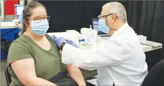  ?? GORDON LAMBIE ?? Jessika Lagimonièr­e of Cowansvill­e was among the first people in the region to recieve the COVID-19 vaccine as a campaign to inoculate healthcare workers got underway on Wednesday.