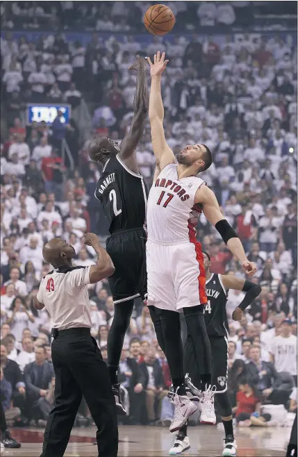  ?? — GETTY IMAGES FILES ?? Raptors centre Jonas Valanciuna­s leaps up to get the opening tip-off against the Brooklyn Nets. The Raptors have devised a quirky ritual as a ‘motivation­al team inside joke.’