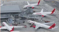  ?? (Luisa Gonzalez/Reuters) ?? AN AERIAL VIEW shows Colombian airline Avianca’s planes parked at El Dorado Internatio­nal Airport last month amid the COVID-19 outbreak in Bogota.