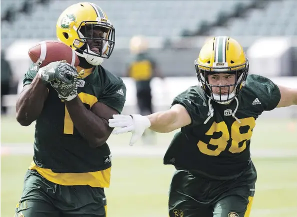  ?? DAVID BLOOM ?? Linebacker­s Christophe Mulumba-Tshimanga and Adam Konar help give the Eskimos some key Canadian talent on defence.