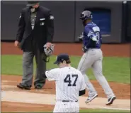  ?? FRANK FRANKLIN II — THE ASSOCIATED PRESS ?? New York Yankees pitcher Jordan Montgomery reacts as Tampa Bay Rays’ Manuel Margot runs the bases after hitting a two-run homer during the fourth inning of Tampa Bay’s 6-3 win on Saturday.