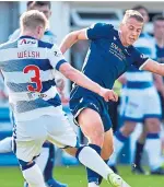  ??  ?? Debutant Graham Dorrans, top, in action for Dundee at Cappielow; Andrew Nelson, above, challenges Stephen Welsh. SNS.