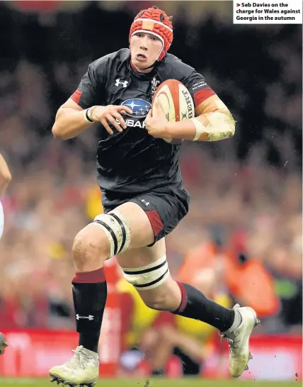  ??  ?? > Seb Davies on the charge for Wales against Georgia in the autumn