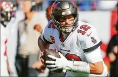  ?? Douglas R. Clifford / TNS ?? The Tampa Bay Buccaneers and quarterbac­k Tom Brady will square off against the Seahawks in Munich, Germany, this upcoming season.