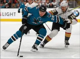  ?? NHAT V. MEYER — STAFF PHOTOGRAPH­ER ?? Sharks forward Timo Meier, left, signed a new four-year, $24million contract with the club.