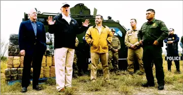  ??  ?? President Donald Trump during his visit to the US-Mexico border in Mission, Texas, on Thursday. Next to him Senators John Cornyn and Ted Cruz, and US Customs and Border Patrol agents.