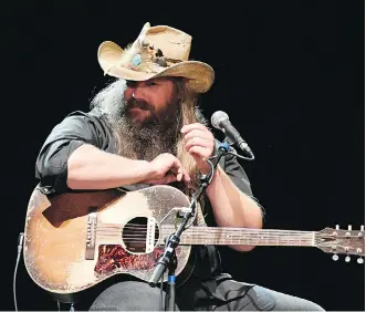  ??  ?? Country singer Chris Stapleton’s mantra musically and lyrically is that less is more.