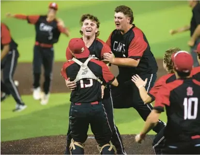  ?? JOHN GILLIS/FOR BALTIMORE SUN MEDIA ?? Spalding pitcher Parker Thomas, facing camera, and catcher Ethan McNally hug to celebrate after a 2-0 victory over Calvert Hall on Sunday to win the MIAA A Conference title for the second straight year at Joe Cannon Stadium in Hanover.