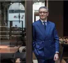  ??  ?? LEFT TO RIGHT
The SL Reiwa walk-in wardrobe system from Giorgetti; Giovanni del Vecchio, the CEO of Giorgetti; the iconic Progetti armchair from Giorgetti features armrests designed in a style similar to the handle of an antique walking stick