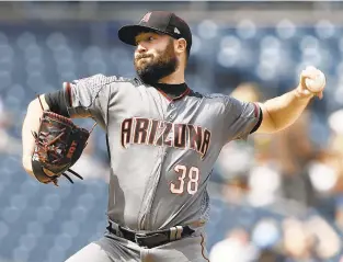  ?? ALEX GALLARDO/THE ASSOCIATED PRESS ?? Diamondbac­ks starting pitcher Robbie Ray delivers to a San Diego Padres batter in September in San Diego.