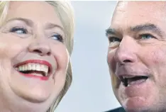  ?? — Reuters file photo ?? Hillary Clinton and Tim Kaine react during a campaign rally at Ernst Community Cultural Centre in Annandale, Virginia.