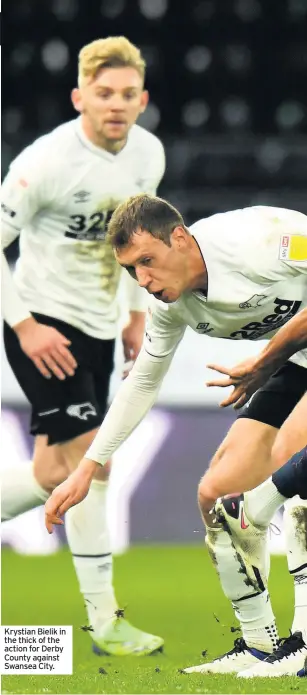  ??  ?? Krystian Bielik in the thick of the action for Derby County against Swansea City.