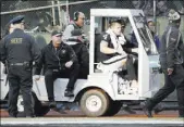  ?? TONY AVELAR/THE ASSOCIATED PRESS ?? Raiders quarterbac­k Derek Carr rides up front while being carted off with a broken right leg in the fourth quarter against the Indianapol­is Colts on Saturday.