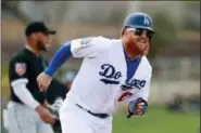  ?? CARLOS OSORIO — THE ASSOCIATED PRESS FILE ?? Los Angeles Dodgers third baseman Justin Turner suffered a broken leftwrist after being hit by a pitch during a spring training game against the Oakland Athletics Monday.