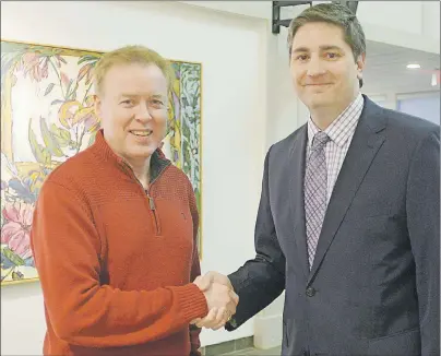  ?? MITCH MACDONALD/THE GUARDIAN ?? Stratford Mayor David Dunphy, left, congratula­tes Jody Jackson after winning the byelection for the Ward 2 council seat in the town on Monday. Jackson will fill the vacancy left on council when former Coun. Diane Griffin was appointed to the Senate late last year.