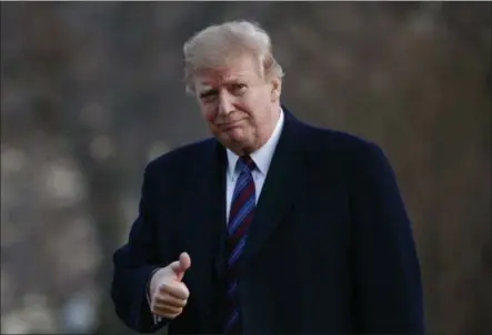  ?? CAROLYN KASTER — ASSOCIATED PRESS ?? President Donald Trump gives a thumbs-up after arriving on Marine One on the South Lawn of the White House in Washington on Friday.