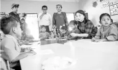  ??  ?? HannahYeoh (second right) speaking with students atTabika Kemas yesterday. - Bernama photo