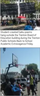  ??  ?? Student-created haiku poems hang outside the Trenton Board of Education building during the Trenton Public Schools Back to School Academic Extravagan­za Friday.